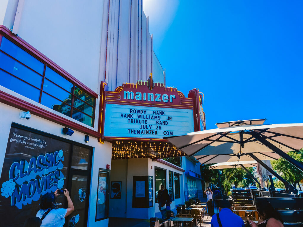 Event organizer demonstrating AI-powered tools for content creation at community event