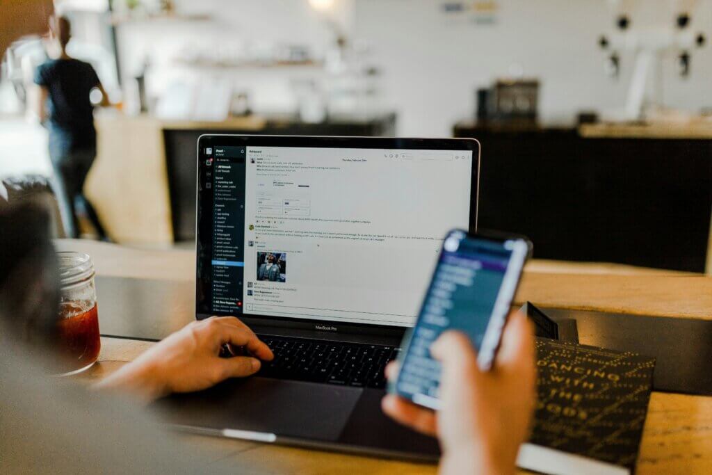 Cosmetic surgeon marketing—clinic staff managing bookings and patient communications on phone and computer.