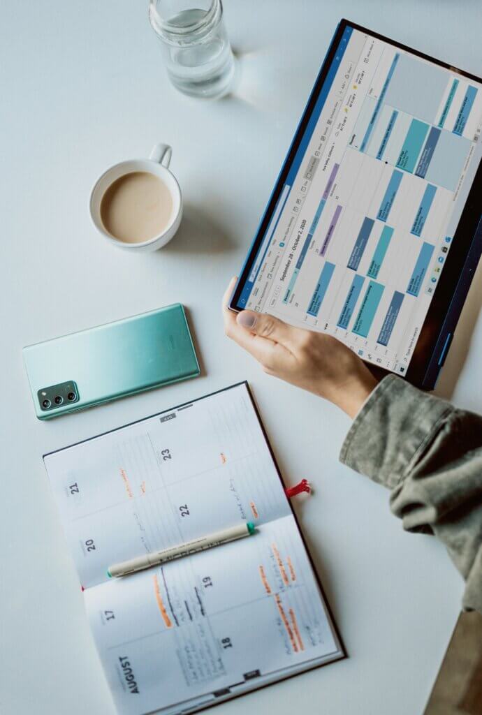 Cosmetic surgeon marketing—patient using tablet to book cosmetic surgery appointment online.